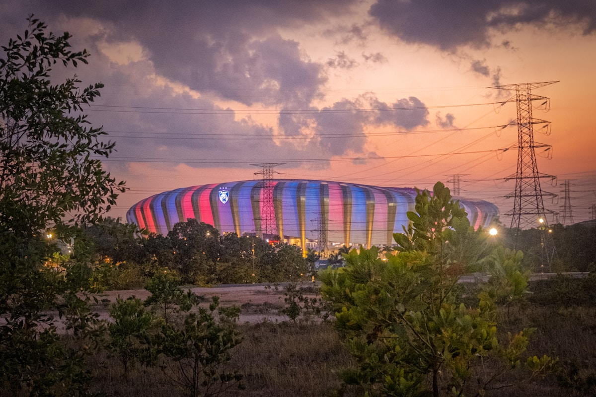 Illuminated stadium under dramatic sunset - NBA Draft Night live coverage