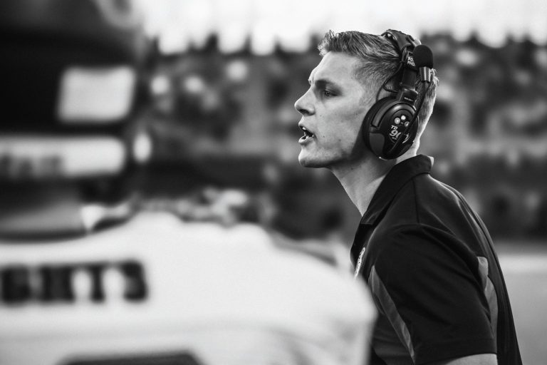Football coach on the field, used to illustrate the late-season analytical context of the 2025 college football conference championship race.