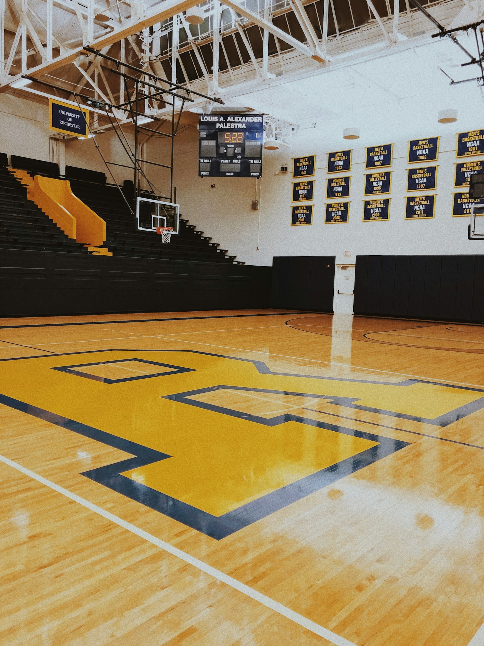An empty basketball court at dusk, used to illustrate the quiet statistical truth that performance tends to drift back toward its long-term average.