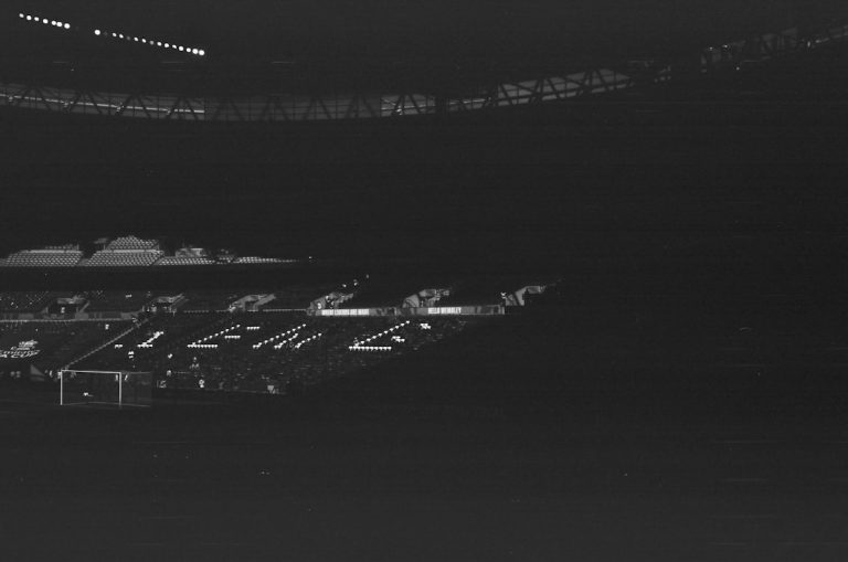 Dimly lit stadium at night with faint lights - NFL Preseason Week 1 garbage-time