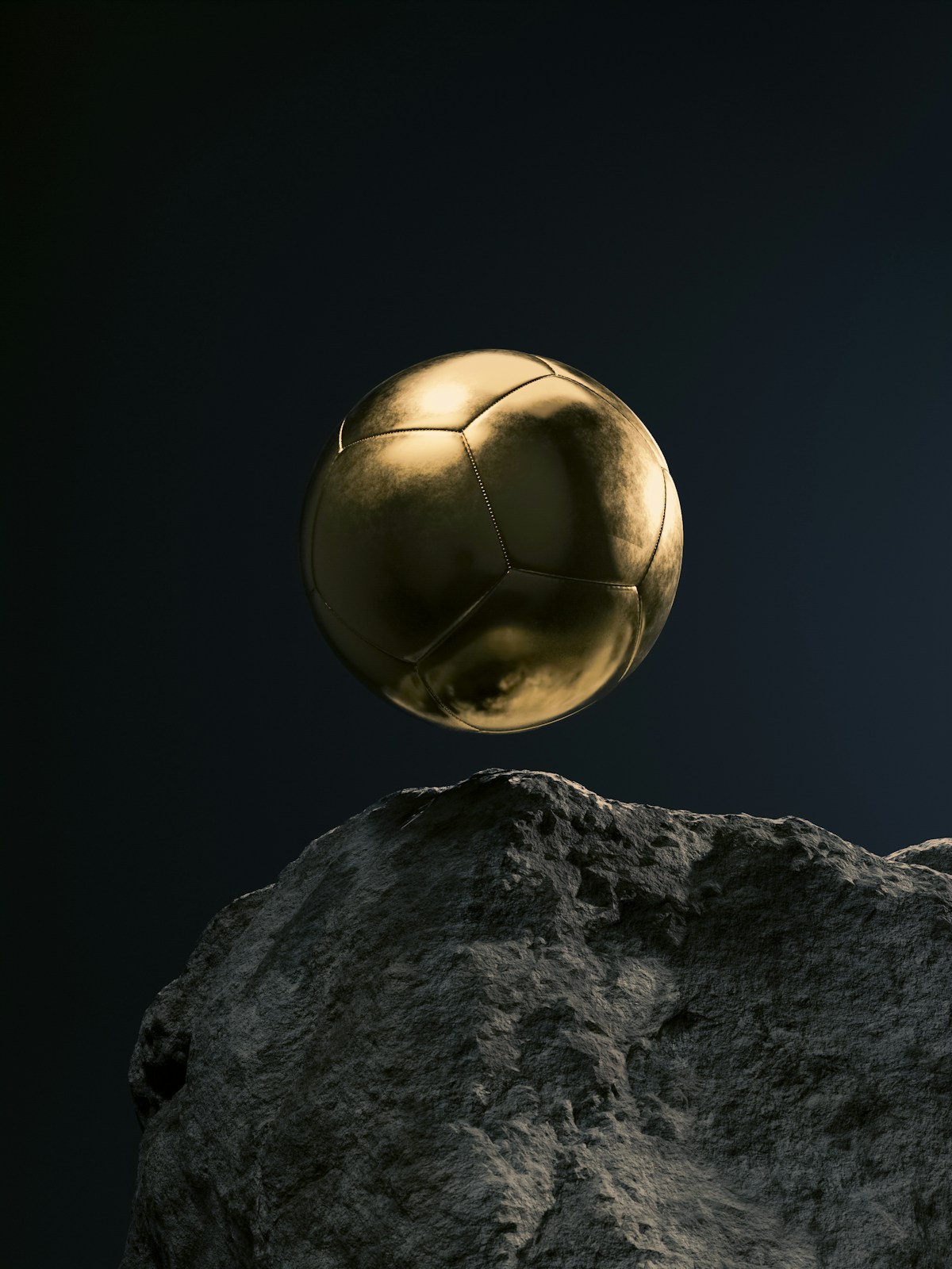 Golden soccer ball on rock - World Cup Final live coverage