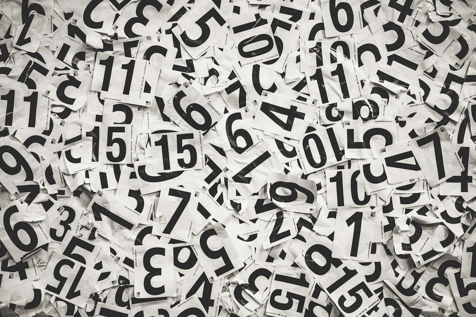 Scattered black numbers on a white paper background, used to illustrate the Leicester Problem and the way expected goals reads numbers against the result.