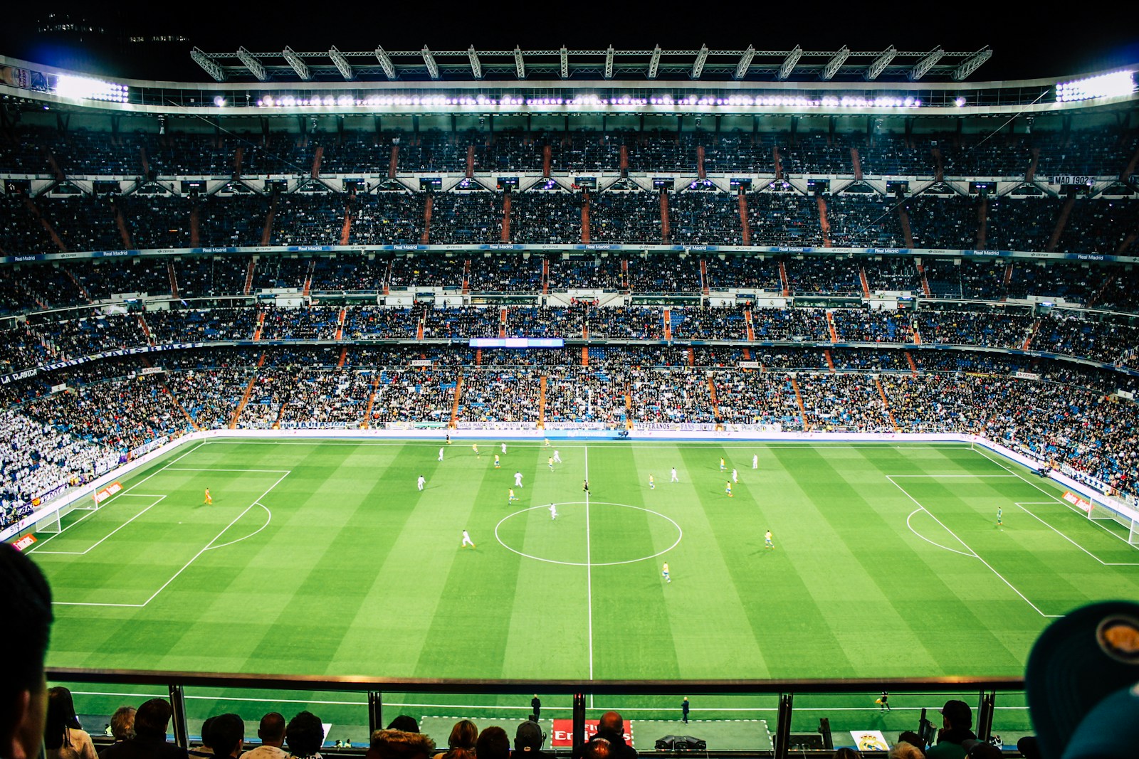 Wide stadium view of a soccer match under lights, used for schedule analysis
