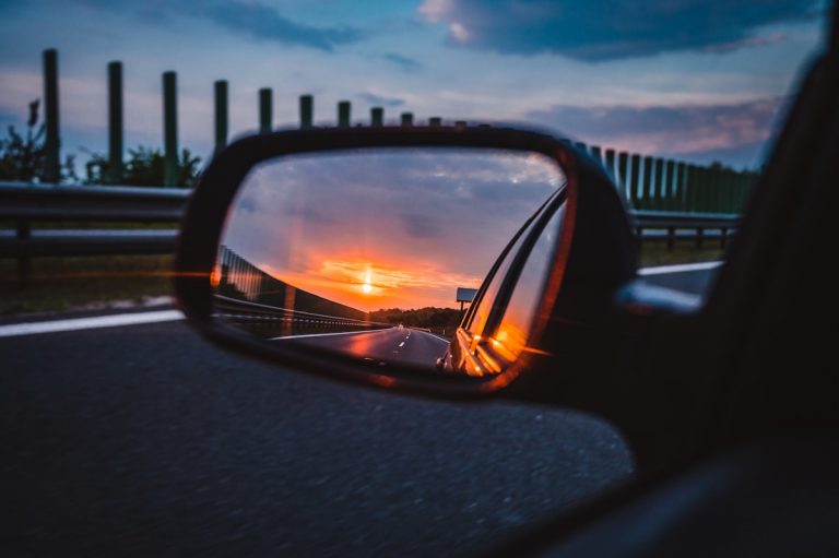 Rear view mirror reflecting sunset - Half-year methods retrospective