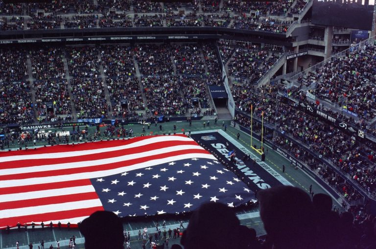 American flag waving in stadium - USA vs Paraguay tournament match