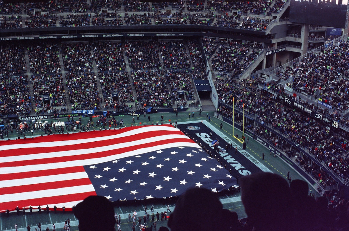 American flag waving in stadium - USA vs Paraguay tournament match