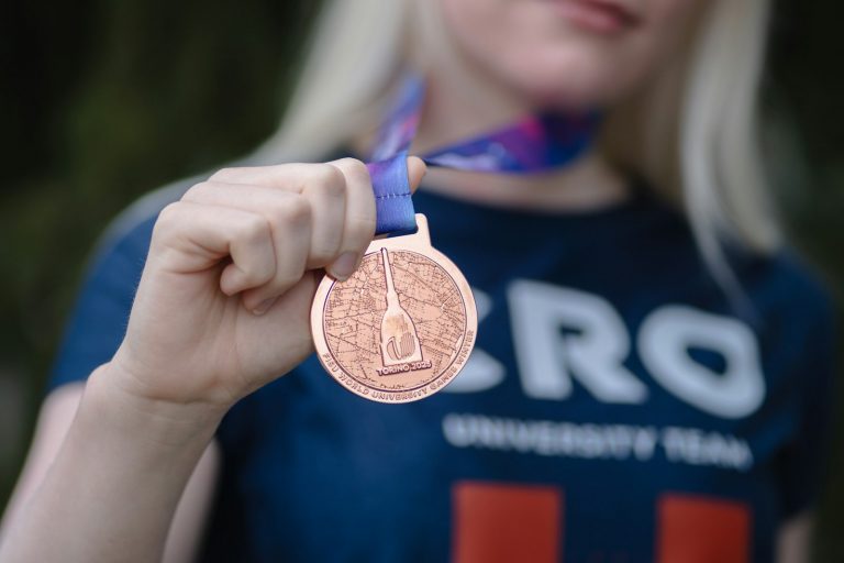 An athlete displaying a bronze medal, used to illustrate the World Cup Bronze match and Final preview.