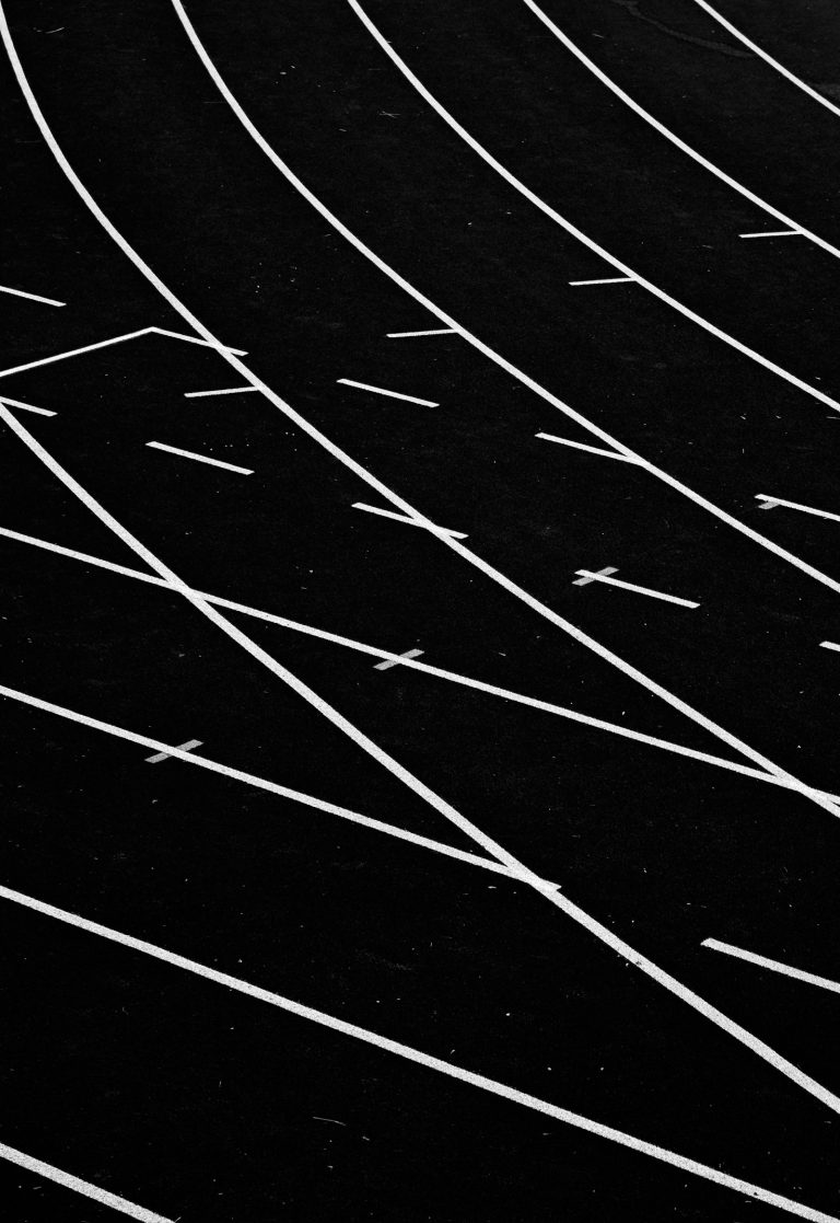 White lines on a race track field, used to illustrate the WNBA 2026 playoff race with six weeks remaining.