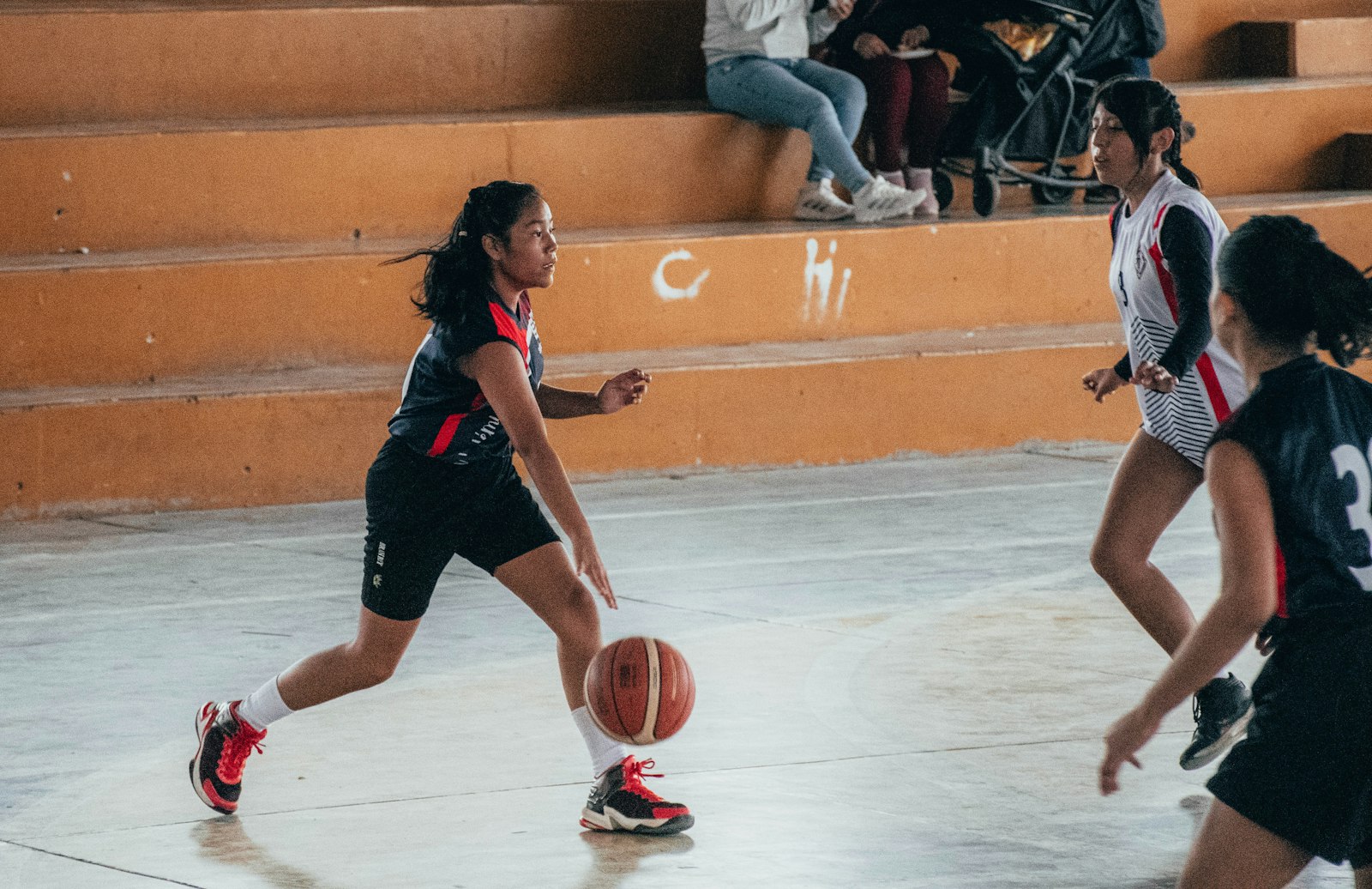 A group of women playing a basketball game, used to illustrate the lineup-level evaluation that WNBA on/off splits attempt to capture.