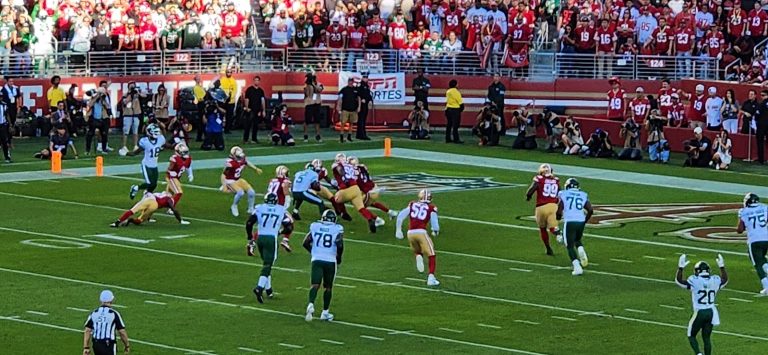 College football game underway in stadium - CFP committee SP+ bracket disagreement