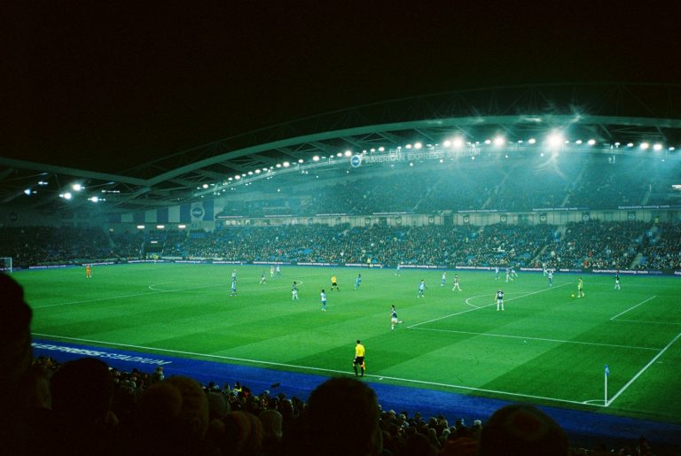 Soccer match at night in lit stadium - UCL Round of 16 Liverpool vs PSG