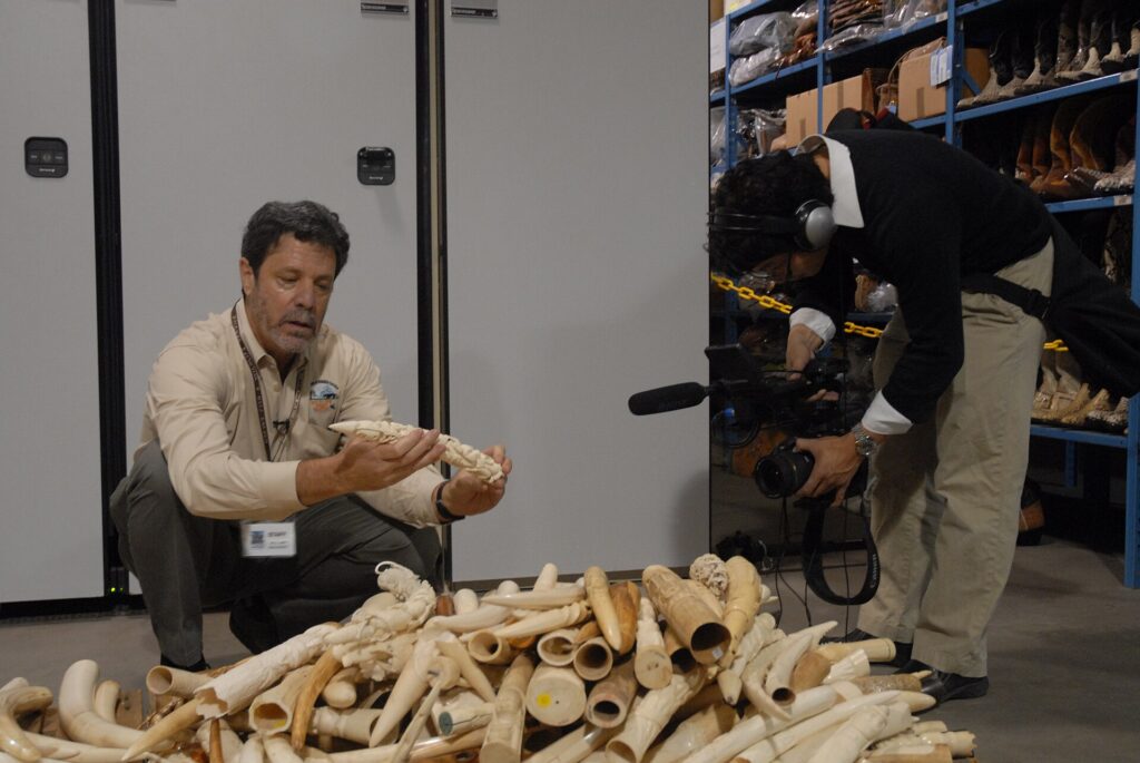 Reporters holding recorders and phones in a tight semicircle during a short interview
