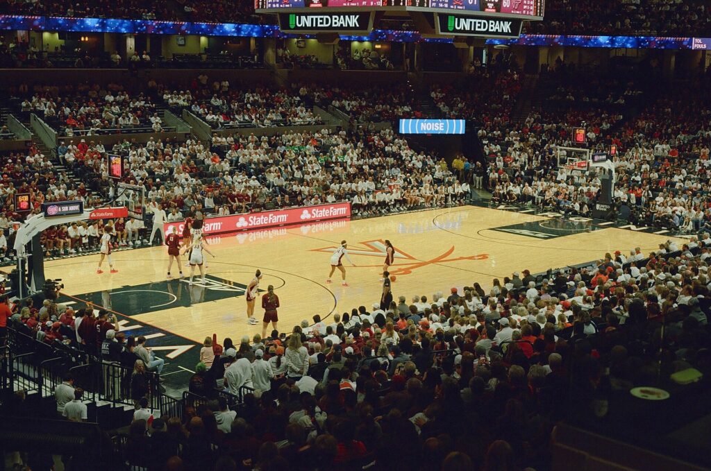 A shot clock mounted above a basketball backboard with only seconds remaining