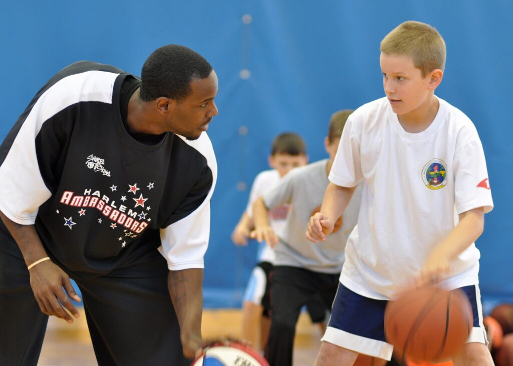 A ball handler lifting his head to look past a defender before committing to a decision